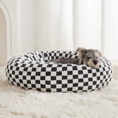 Cama donut BFPETHOME para perros medianos, ofrece soporte cómodo.