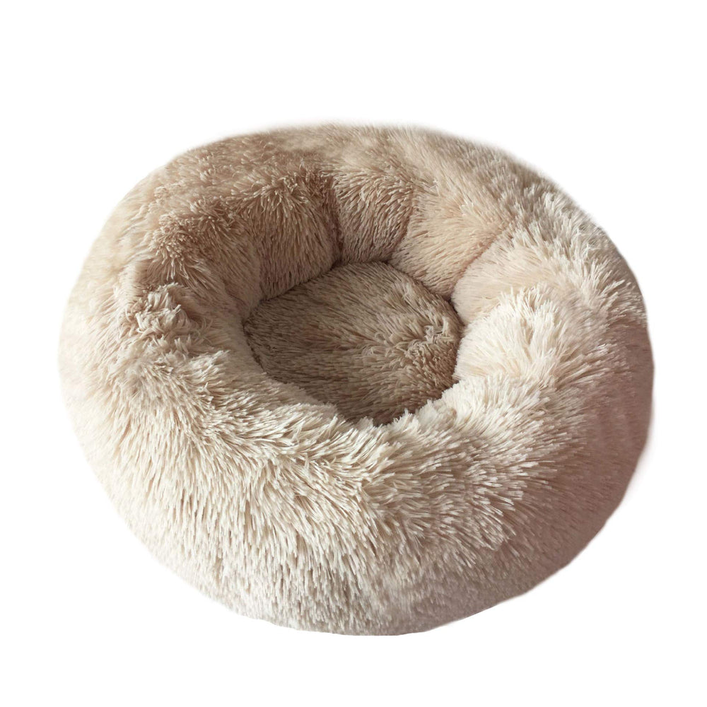 Cama Bodiseint de forma rosquilla brinda abrigo cálido a la mascota