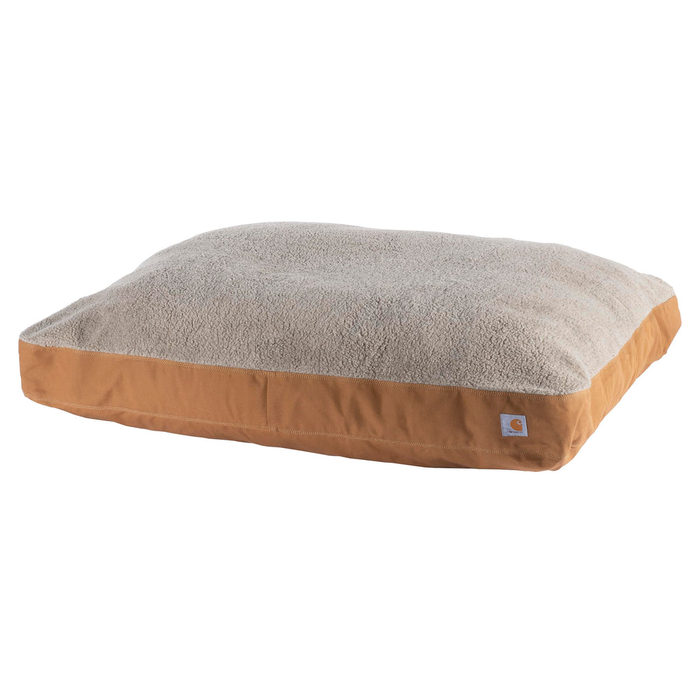 Cama para perro Carhartt en lona dura, vista frontal, resistencia diaria.