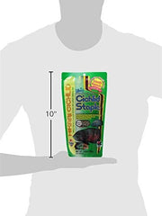 Cíclidos consumen pellets flotantes de Hikari para monitorear consumo.