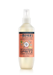 Mrs. Meyer's Clean Day cat deodorizing spray bottle refreshing a cat's coat.