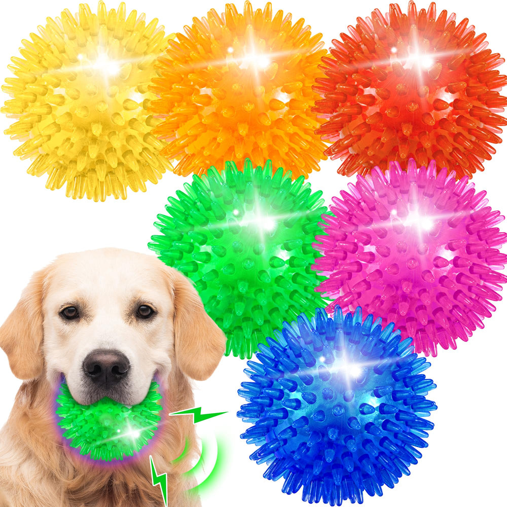 Pelota espinosa de Ousiya iluminada en amarillo, ideal para juego al aire libre.