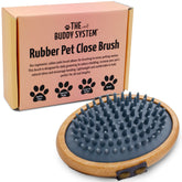 The Buddy System cepillo palma oval de goma gris para masajes suaves