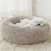 Cama donut WNPETHOME para perros pequeños, confort y descanso profundo.