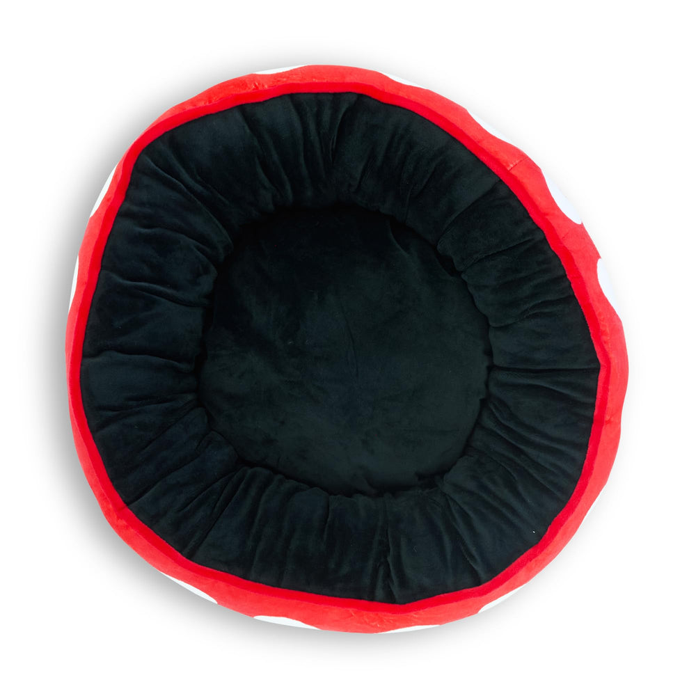 Buckle-Down cama donut para perro, vista lateral que muestra tamaño y relleno mullido.