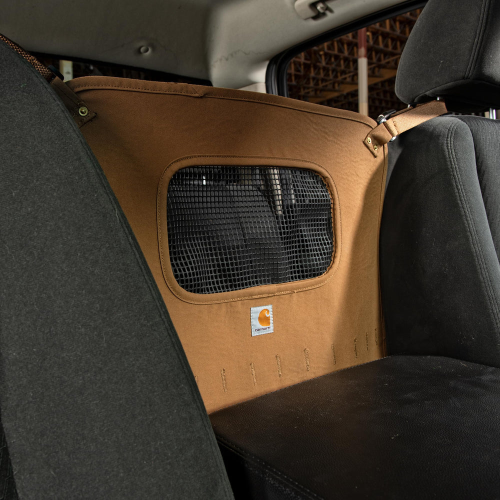 Carhartt barrera duradera en nylon duck, ideal para viajes diarios.