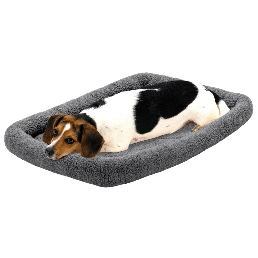 Cama para perro Furhaven mediana en jaula con borde Sherpa gris para confort.
