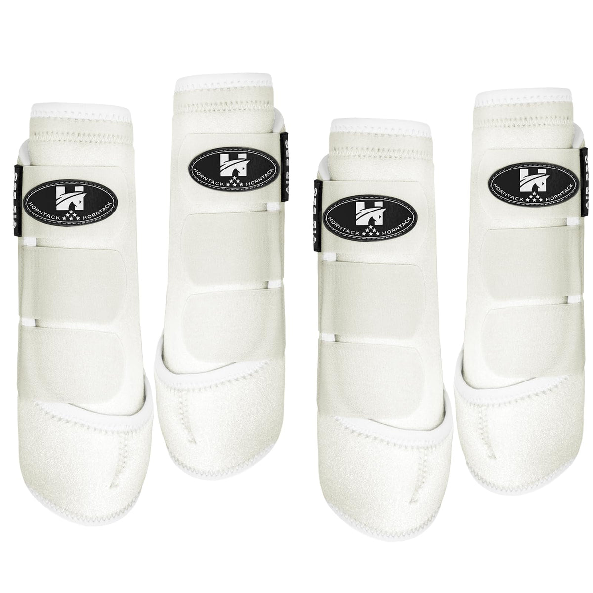 Botas Horntack para espinillas en caballo blanco grande, protección de tendones y ajuste frontal.