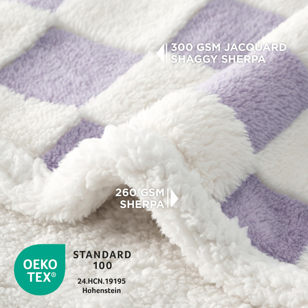Manta reversible LE SURE con sherpa y jacquard, comodidad diaria.