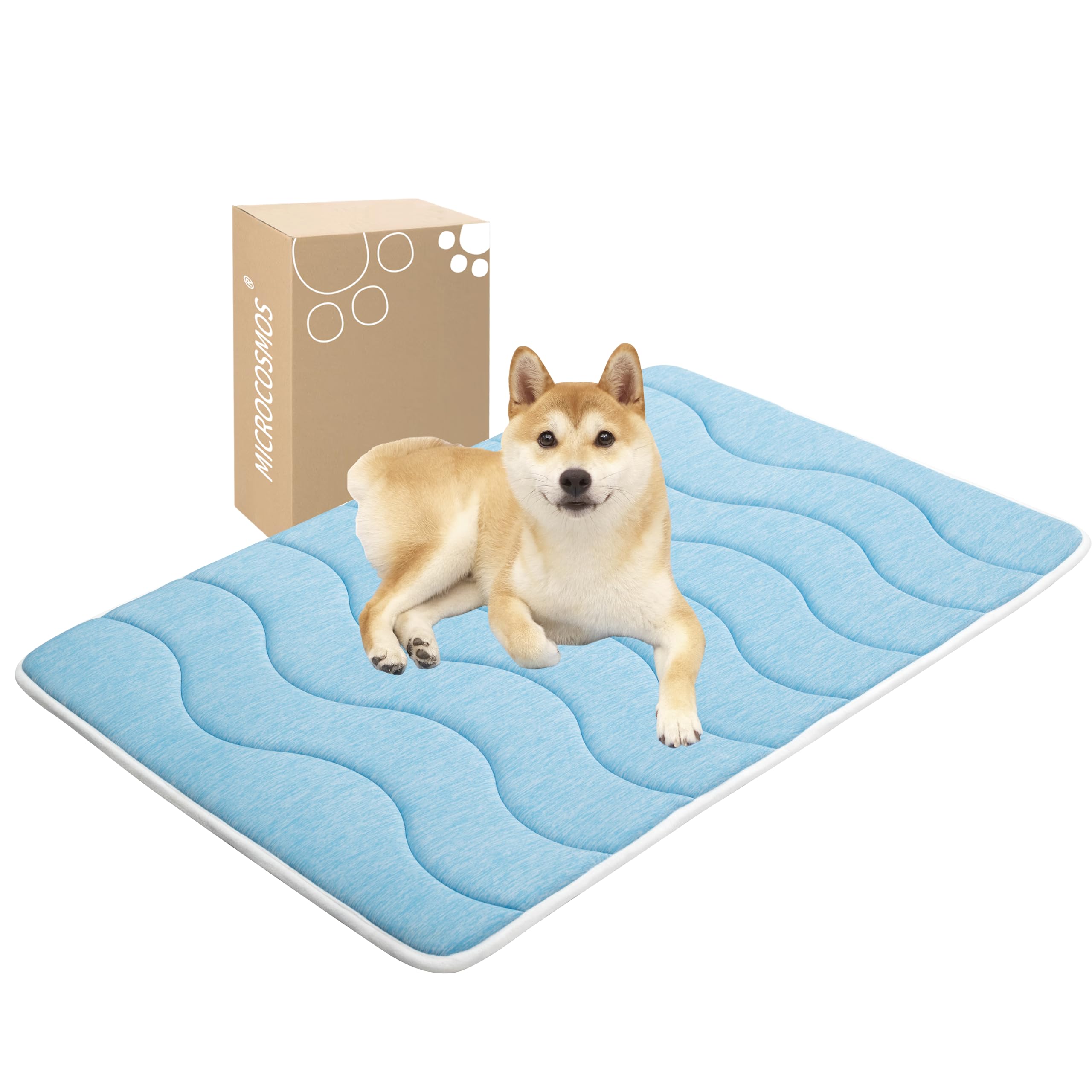 MICROCOSMOS cama para perros de color azul cielo con superficie fría para días cálidos.