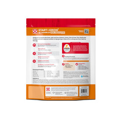 Pollitos comiendo Purina Start and Grow para desarrollo saludable.