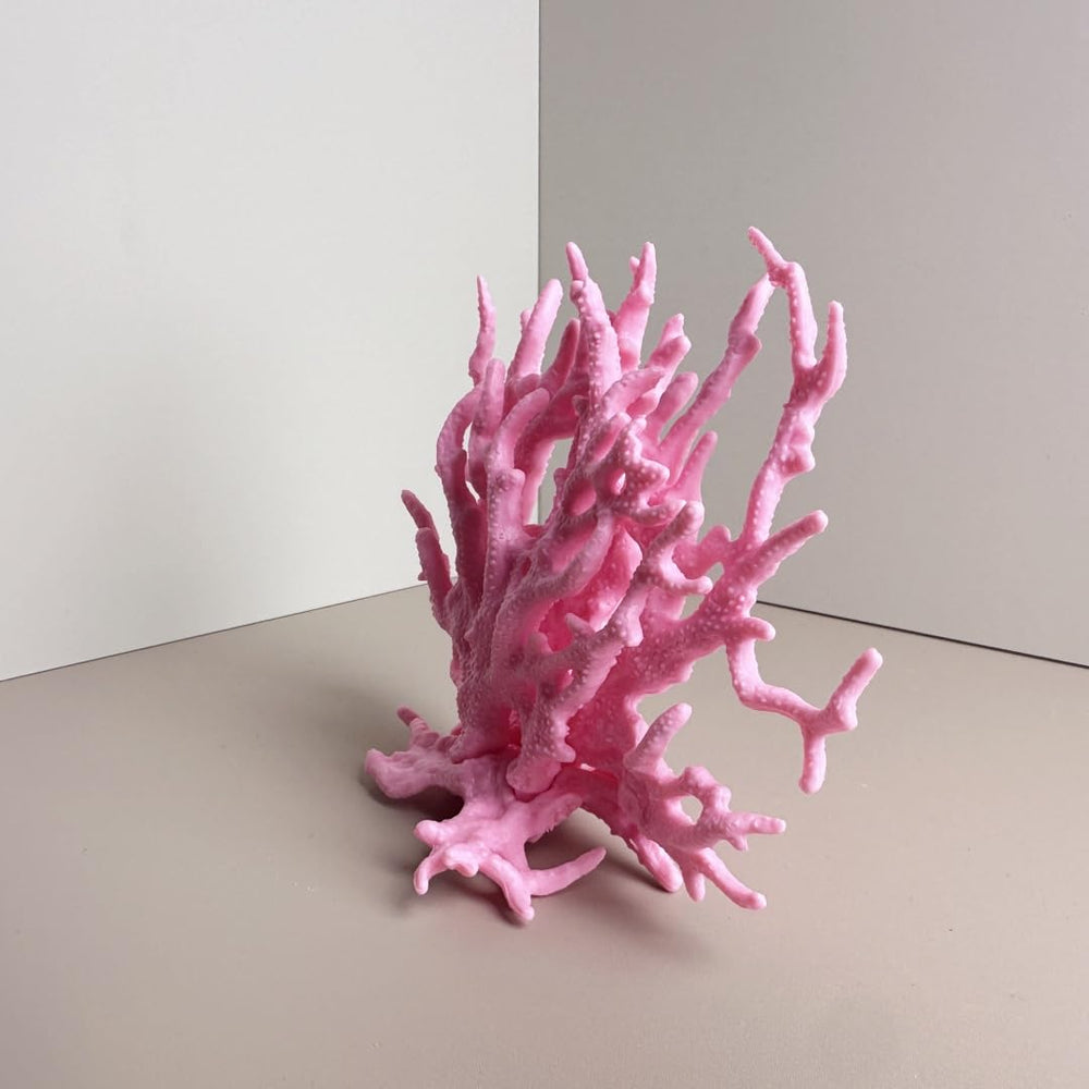 SwandTanpand cueva para peces en acuario rosa.