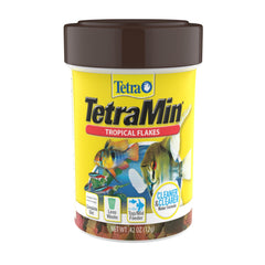 TetraMin copos tropicales en envase, alimento completo para peces tropicales.