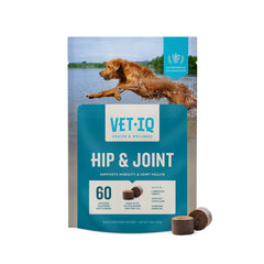 VetIQ Glucosamina: botella con pastillas blandas para movilidad diaria del perro.