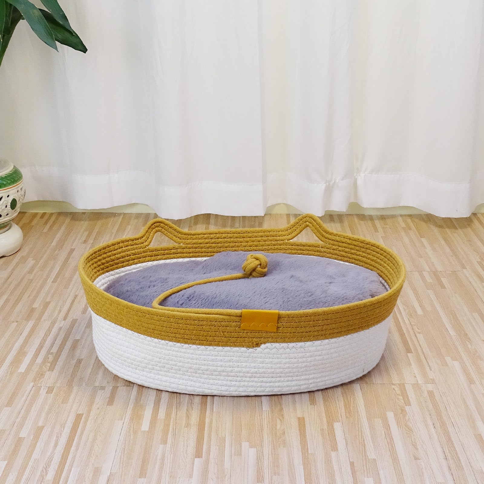 Cama para gatos Yaruiguang tejida en cuerda, refugio ovalado y cómodo.